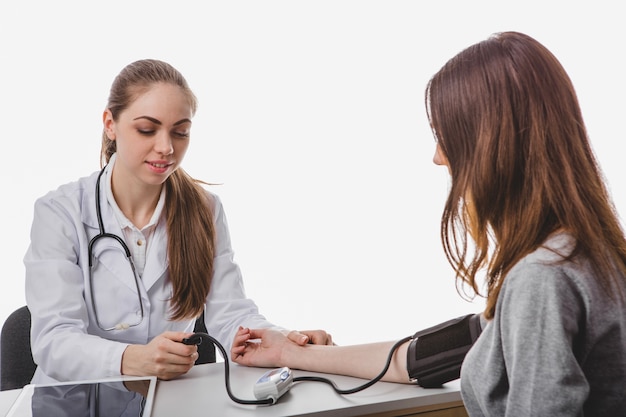 Woman examining arterial tension