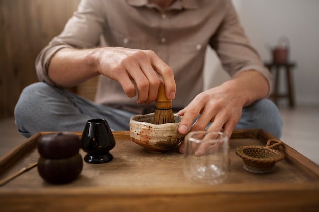 Man preparing matcha tea front view