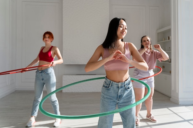 Young women with hula hoops